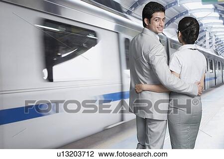 Business couple at a subway station View Large Photo Image Stock Image - Business couple at a subway station. Fotosearch