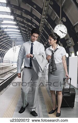 Business couple at a subway station View Large Photo Image Stock Image - Business couple at a subway station. Fotosearch