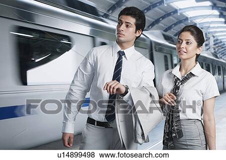 Business couple at a subway station View Large Photo Image Stock Photo - Business couple at a subway station. Fotosearch