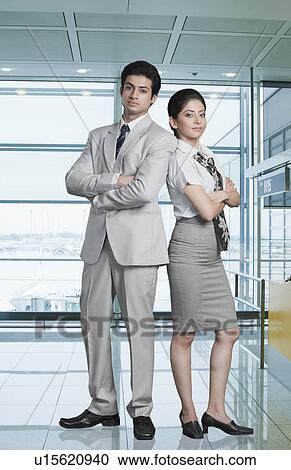 Business couple at an airport lounge View Large Photo Image Stock Image - Business couple at an airport lounge. Fotosearch