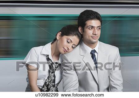Business couple at an airport lounge View Large Photo Image Stock Photo - Business couple at an airport lounge. Fotosearch