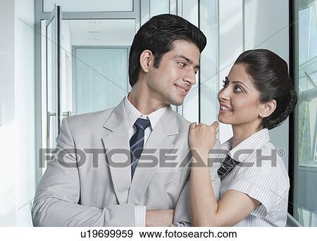 Business couple at an airport lounge View Large Photo Image Stock Photo - Business couple at an airport lounge. Fotosearch