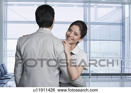 Business couple at an airport lounge View Large Photo Image Stock Photograph - Business couple at an airport lounge. Fotosearch