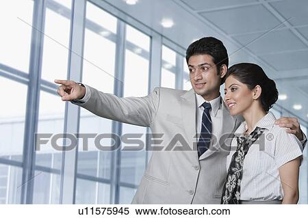 Business couple at an airport lounge View Large Photo Image Stock Photography - Business couple at an airport lounge. Fotosearch