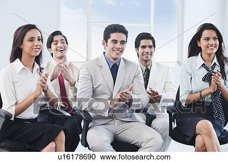 Business executives applauding at a meeting View Large Photo Image Stock Image - Business executives applauding at a meeting. Fotosearch