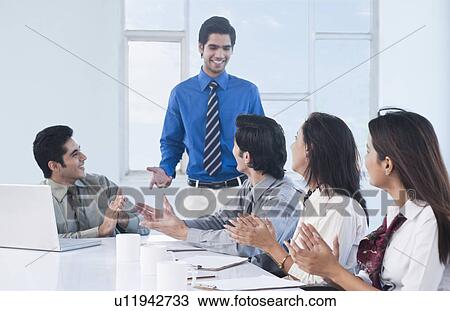 Business executives discussing in a meeting View Large Photo Image Stock Image - Business executives discussing in a meeting. Fotosearch
