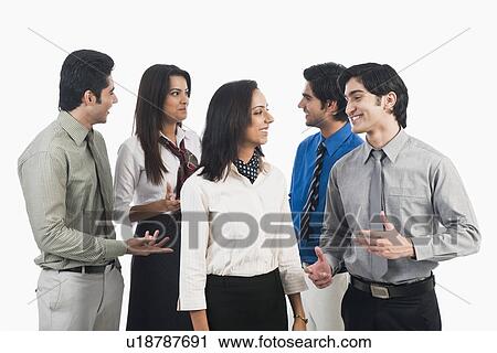 Business executives discussing View Large Photo Image Stock Image - Business executives discussing. Fotosearch