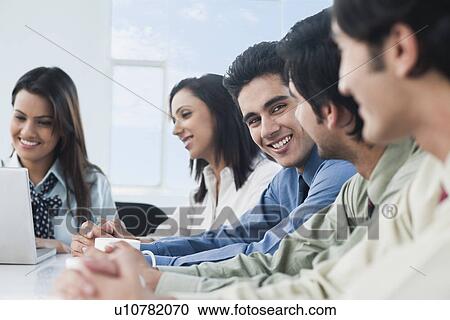 Business executives in a meeting View Large Photo Image Stock Image - Business executives in a meeting. Fotosearch