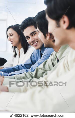Business executives in a meeting View Large Photo Image Stock Image - Business executives in a meeting. Fotosearch
