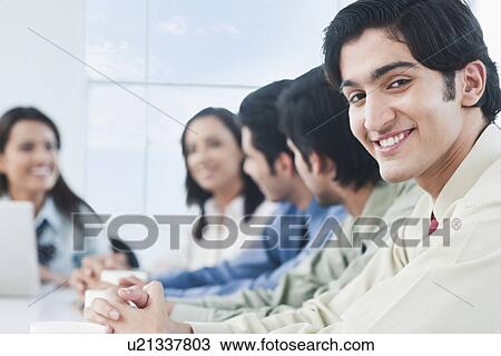 Business executives in a meeting View Large Photo Image Stock Image - Business executives in a meeting. Fotosearch