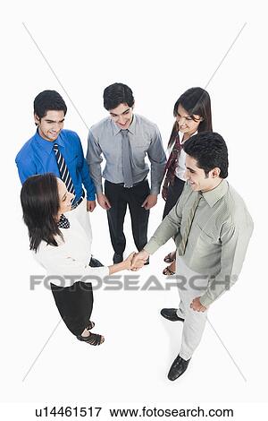 Stock Photo - Business executives shaking hands. Fotosearch