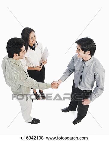 Stock Photo - Business executives shaking hands. Fotosearch