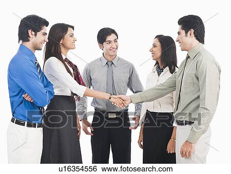 Stock Photograph - Business executives shaking hands. Fotosearch