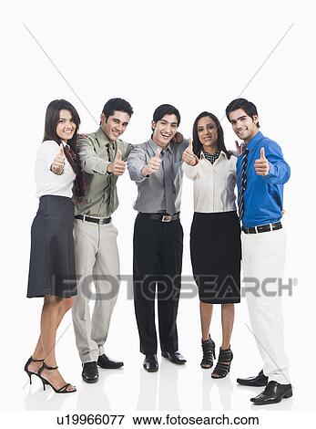 Stock Photo - Business executives showing thumbs up sign. Fotosearch