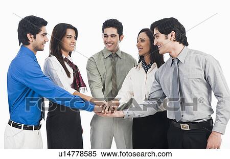 Business executives stacking hands View Large Photo Image Stock Photography - Business executives stacking hands. Fotosearch