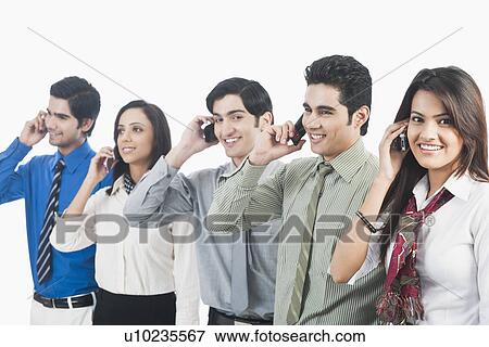 Stock Photo - Business executives talking on mobile phones. Fotosearch