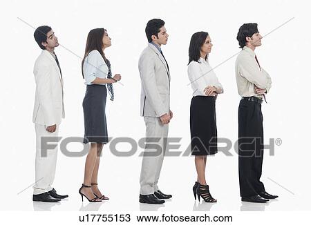 Stock Image - Business executives waiting in a line. Fotosearch