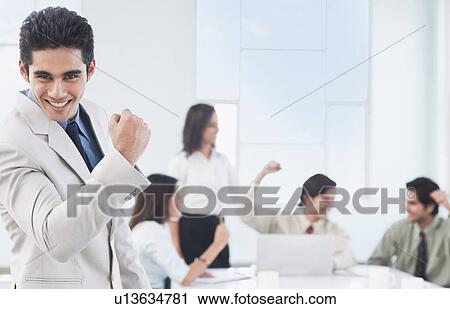 Stock Image - Businessman celebrating his success. Fotosearch