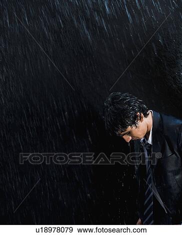 Stock Photo - Businessman enjoying in the rain. Fotosearch