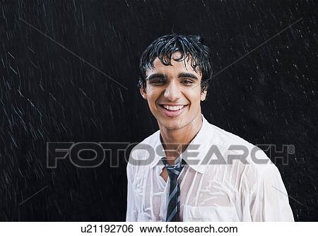 Businessman enjoying in the rain View Large Photo Image Stock Photograph - Businessman enjoying in the rain. Fotosearch