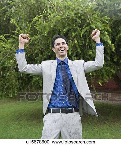 Businessman enjoying rain View Large Photo Image Stock Image - Businessman enjoying rain. Fotosearch
