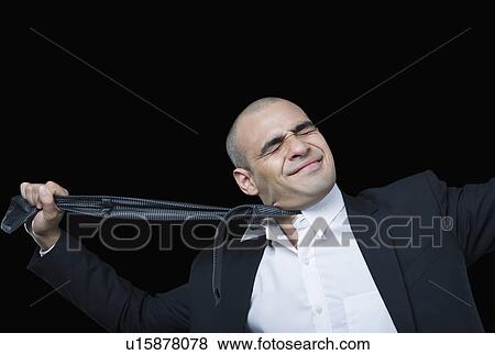 Businessman hanging himself with his tie View Large Photo Image Stock Photo - Businessman hanging himself with his tie. Fotosearch