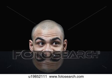 Businessman hiding behind a table View Large Photo Image Stock Image - Businessman hiding behind a table. Fotosearch
