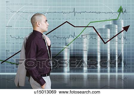 Businessman looking at a line graph View Large Photo Image Stock Photo - Businessman looking at a line graph. Fotosearch