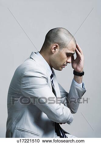 Stock Image - Businessman looking upset. Fotosearch