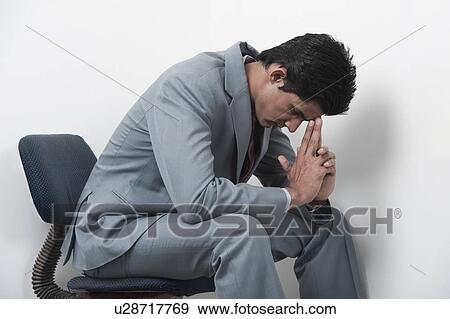 Stock Photo - Businessman looking worried. Fotosearch