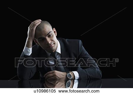 Stock Photography - Businessman looking worried. Fotosearch