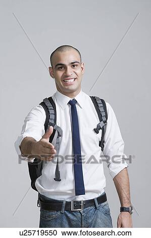 Businessman offering a handshake View Large Photo Image Stock Image - Businessman offering a handshake. Fotosearch