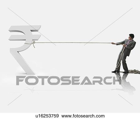Stock Photo - Businessman pulling a rupee symbol. Fotosearch