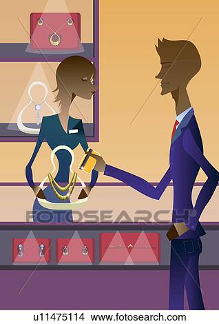 Businessman shopping in a jewelry store View Large Photo Image Picture - Businessman shopping in a jewelry store. Fotosearch