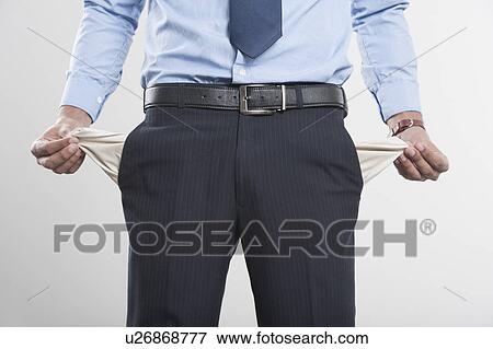 Stock Photo - Businessman showing his empty pockets. Fotosearch