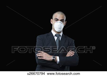 Businessman wearing a pollution mask View Large Photo Image Picture - Businessman wearing a pollution mask. Fotosearch