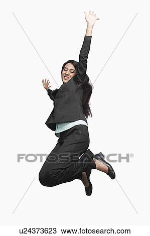 Stock Image - Businesswoman jumping. Fotosearch