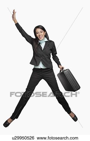 Businesswoman jumping View Large Photo Image Stock Photograph - Businesswoman jumping. Fotosearch