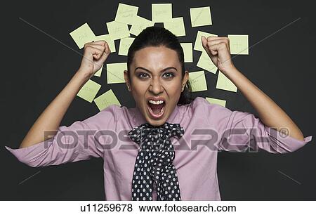 Businesswoman shouting in front of a bulletin board View Large Photo Image Stock Photo - Businesswoman shouting in front of a bulletin board. Fotosearch