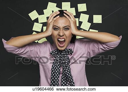 Businesswoman shouting in front of a bulletin board View Large Photo Image Stock Photograph - Businesswoman shouting in front of a bulletin board. Fotosearch