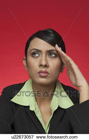 Businesswoman suffering from a headache View Large Photo Image Stock Photo - Businesswoman suffering from a headache. Fotosearch