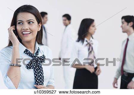 Businesswoman talking on a mobile phone View Large Photo Image Stock Photo - Businesswoman talking on a mobile phone. Fotosearch