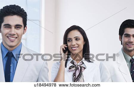 Businesswoman talking on a mobile phone View Large Photo Image Stock Photo - Businesswoman talking on a mobile phone. Fotosearch