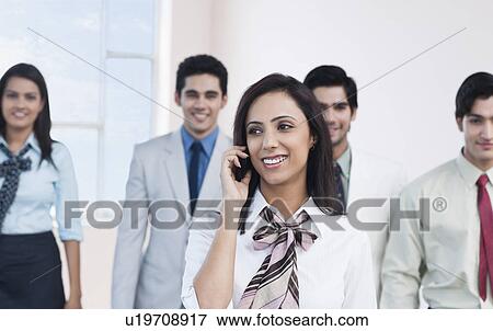 Businesswoman talking on a mobile phone View Large Photo Image Stock Photo - Businesswoman talking on a mobile phone. Fotosearch