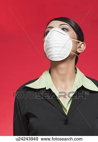 Businesswoman wearing a pollution mask View Large Photo Image Stock Photo - Businesswoman wearing a pollution mask. Fotosearch