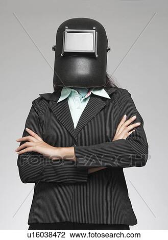 Businesswoman wearing a welding mask View Large Photo Image Stock Image - Businesswoman wearing a welding mask. Fotosearch