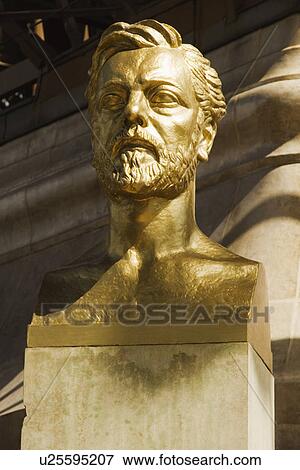 Stock Photo - Bust of Gustave Eiffel near a tower, Eiffel Tower, Paris, France. Fotosearch