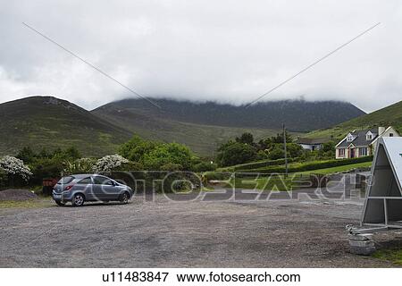 Stock Photo - Car in a village, Ring Of Kerry, County Kerry, Republic of Ireland. Fotosearch