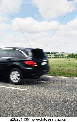 Car moving on the road, Cesky Krumlov, South Bohemian Region, Czech Republic View Large Photo Image Stock Photo - Car moving on the road, Cesky Krumlov, South Bohemian Region, Czech Republic. Fotosearch
