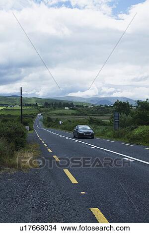 Car on the road, Ring Of Kerry, County Kerry, Republic of Ireland View Large Photo Image Picture - Car on the road, Ring Of Kerry, County Kerry, Republic of Ireland. Fotosearch